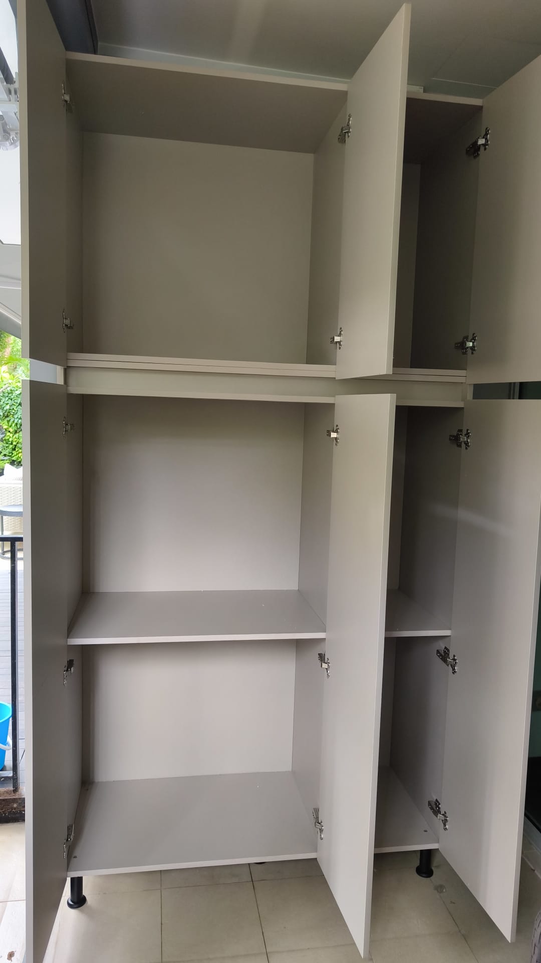 Customised Aluminium Outdoor Tall Cabinet installed delivered at customer home - internal view Customised Aluminium Outdoor Tall Cabinet installed delivered at customer home - internal view